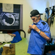 Carlos Torres, 61, a deported Army veteran, puts on his “Seguridad” (security) uniform before going to work at a maquila at his home in Reynosa, Mexico. (Rodolfo Gonzalez/Austin American-Statesman)